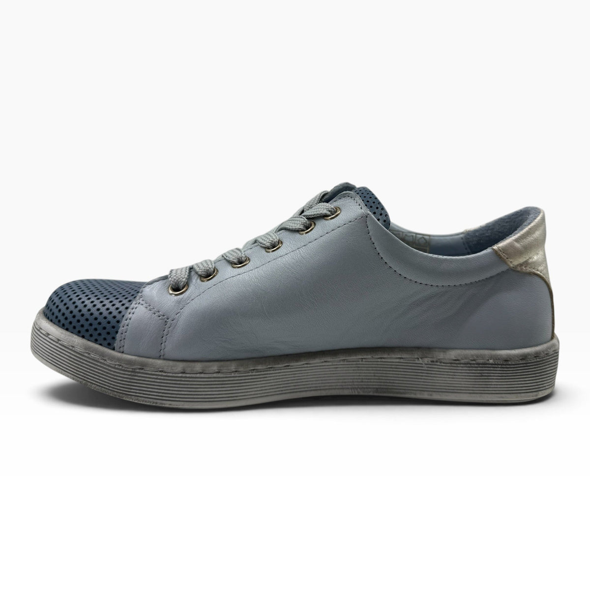 The Shoe Shop Tommie Perf leather sneaker in blue with perforated toe, lace-up front, and metallic heel detail.