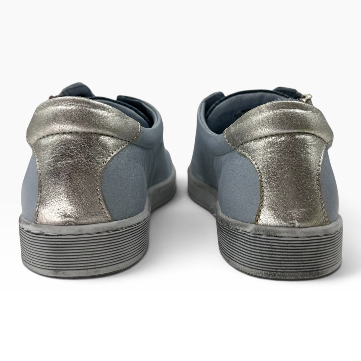 The Shoe Shop Tommie Perf sneakers in blue leather with metallic silver heel accents and textured rubber soles