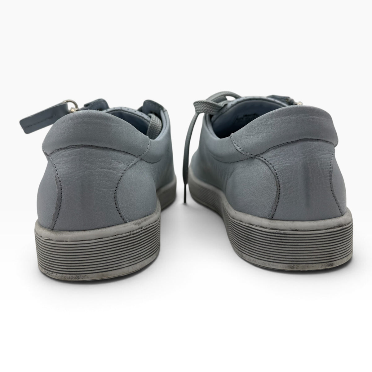 The Shoe Shop Tommie Perf grey leather sneakers viewed from the back showing the rubber sole and heel detail.