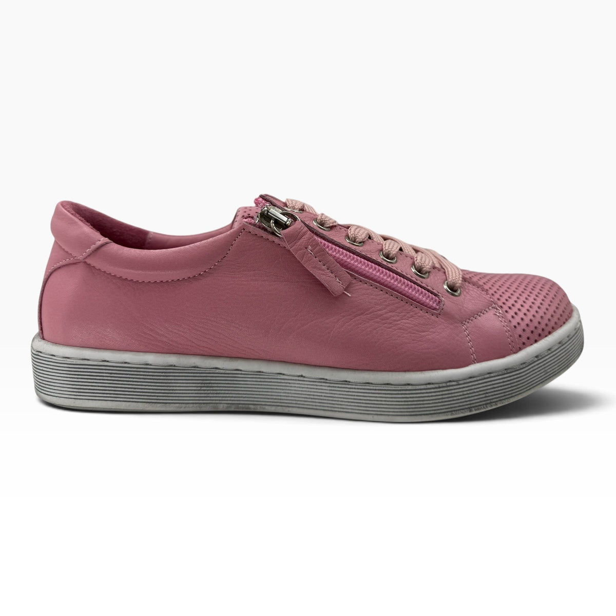 The Shoe Shop Tommie Perf pink leather sneaker with perforated detailing, side zip, and durable rubber sole.