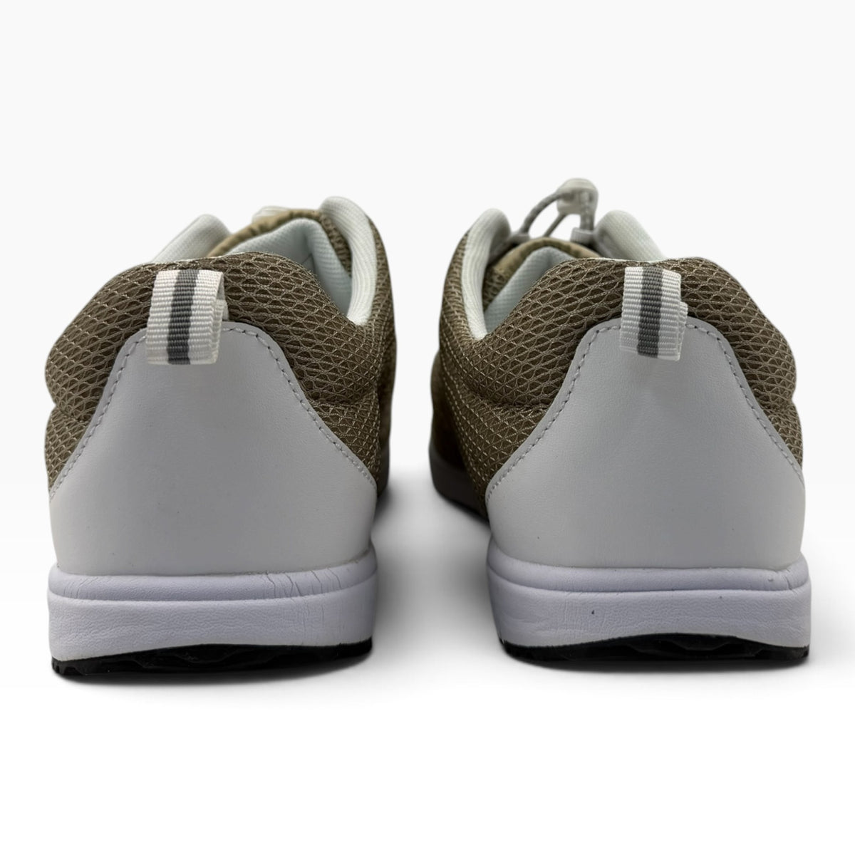 Rear view of The Shoe Shop Travel Walker 2E sneakers in beige mesh with white heel panels and pull tabs.