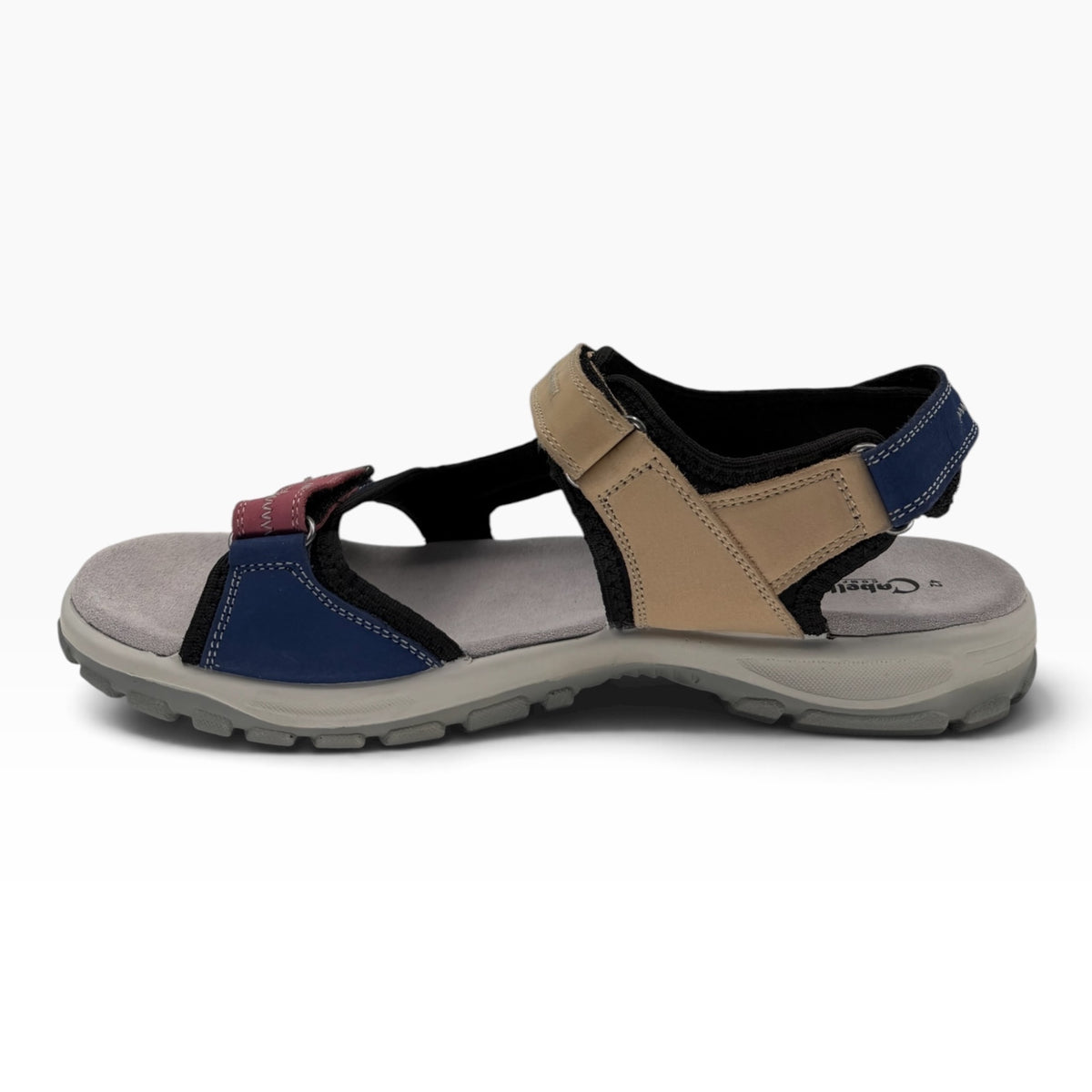 The Shoe Shop Trek sandal featuring a multi-coloured textile upper, three adjustable Velcro straps, and moulded sole.
