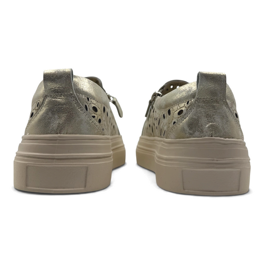 The Shoe Shop Triffic leather sneakers in metallic gold with laser-cut detailing and a beige rubber platform sole.