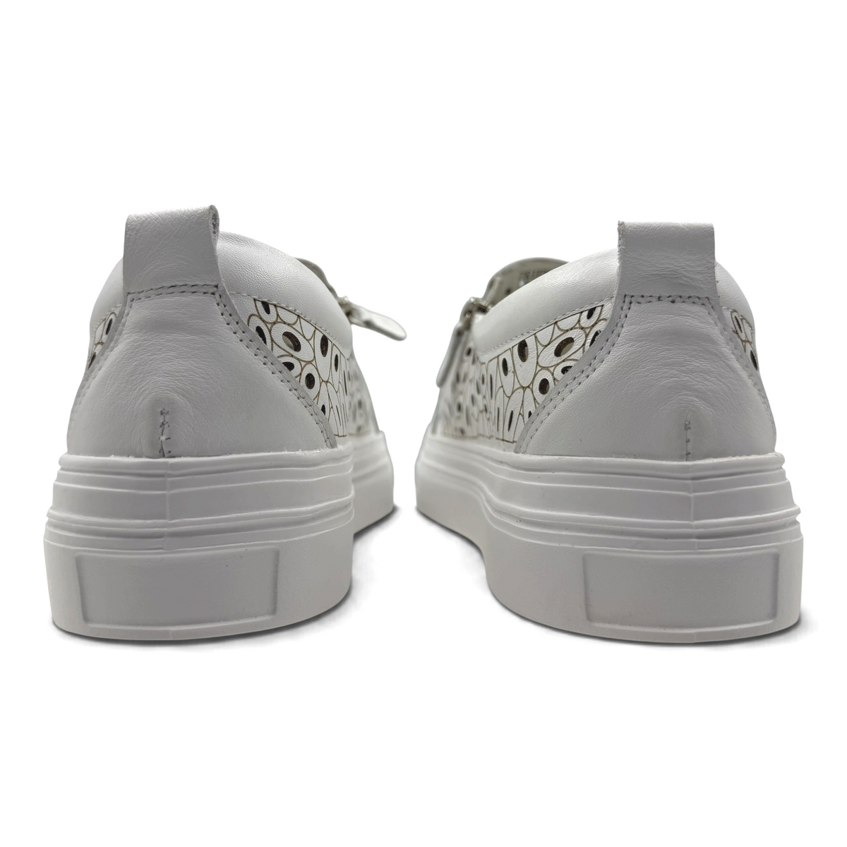 The Shoe Shop Triffic white leather sneakers with laser-cut detailing and platform soles, rear view.