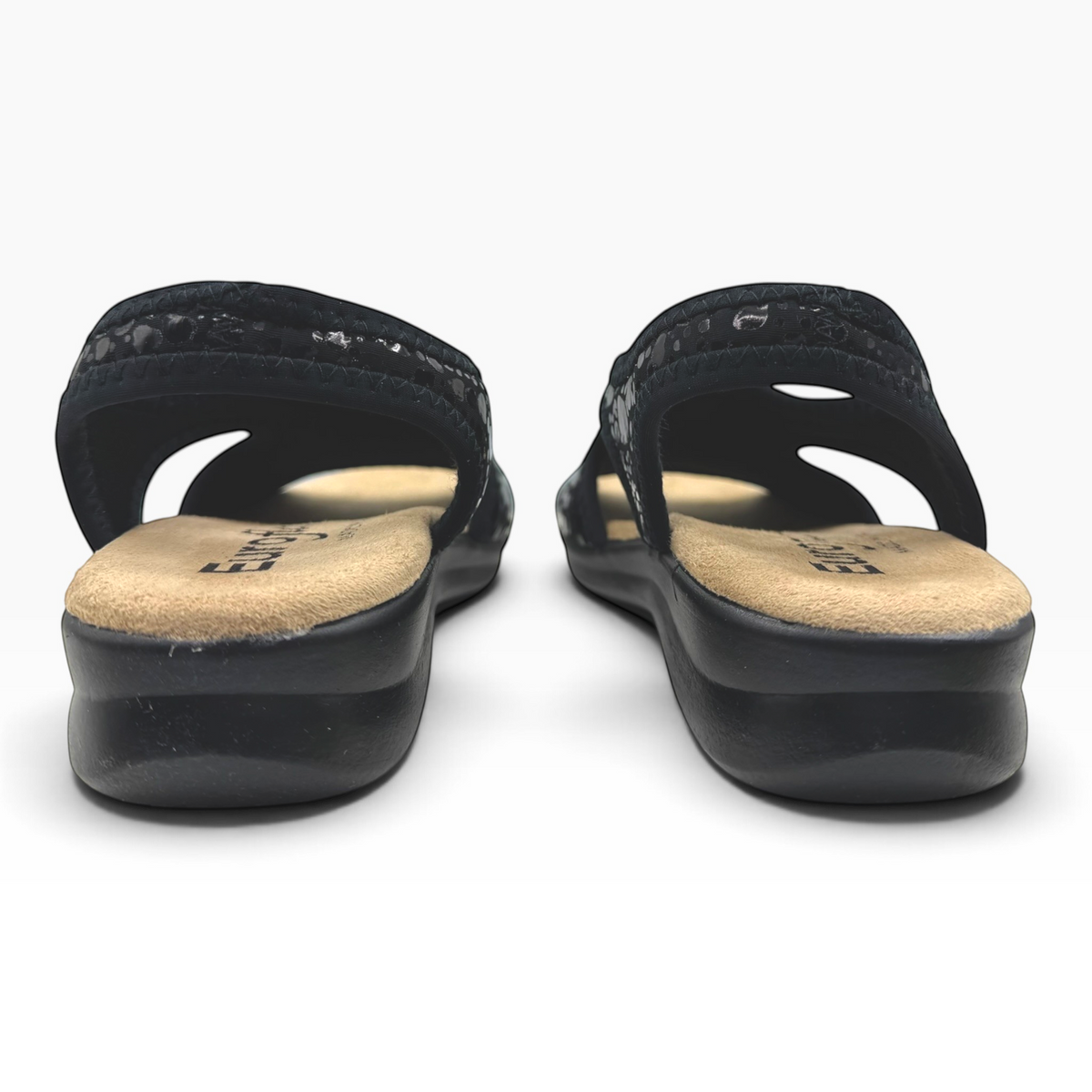 The Shoe Shop Tuscany black vegan sandals with a cushioned low wedge sole and stretchy upper for a flexible fit.