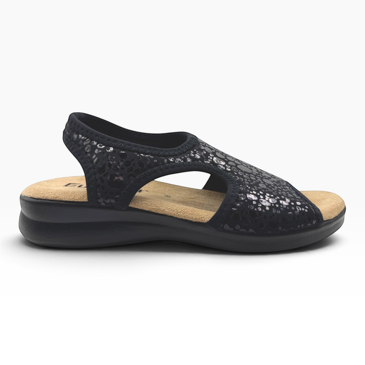 The Shoe Shop Tuscany vegan sandal in black with a textured upper, cushioned footbed, and low wedge heel.