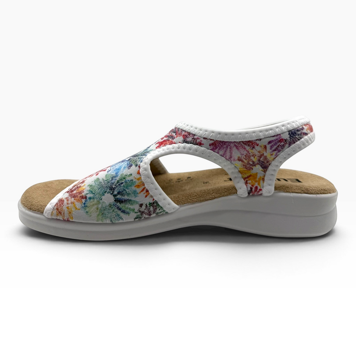 The Shoe Shop Tuscany vegan sandal with a white floral stretchy upper and a comfortable cushioned low wedge sole.