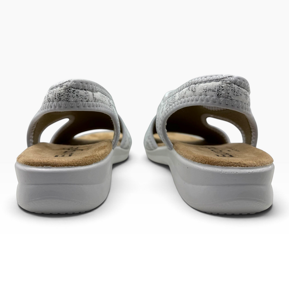 The Shoe Shop Tuscany vegan sandals in grey with a low wedge sole and stretchy upper, viewed from the back.