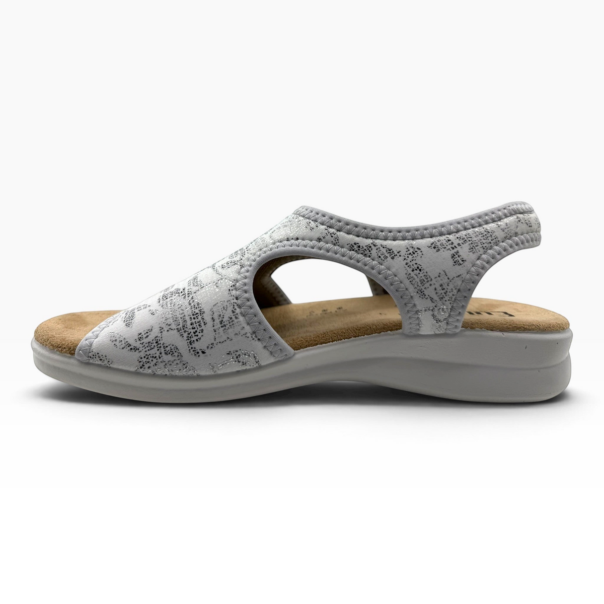 The Shoe Shop Tuscany vegan sandal in silver with a patterned stretchy upper and comfortable low wedge sole.