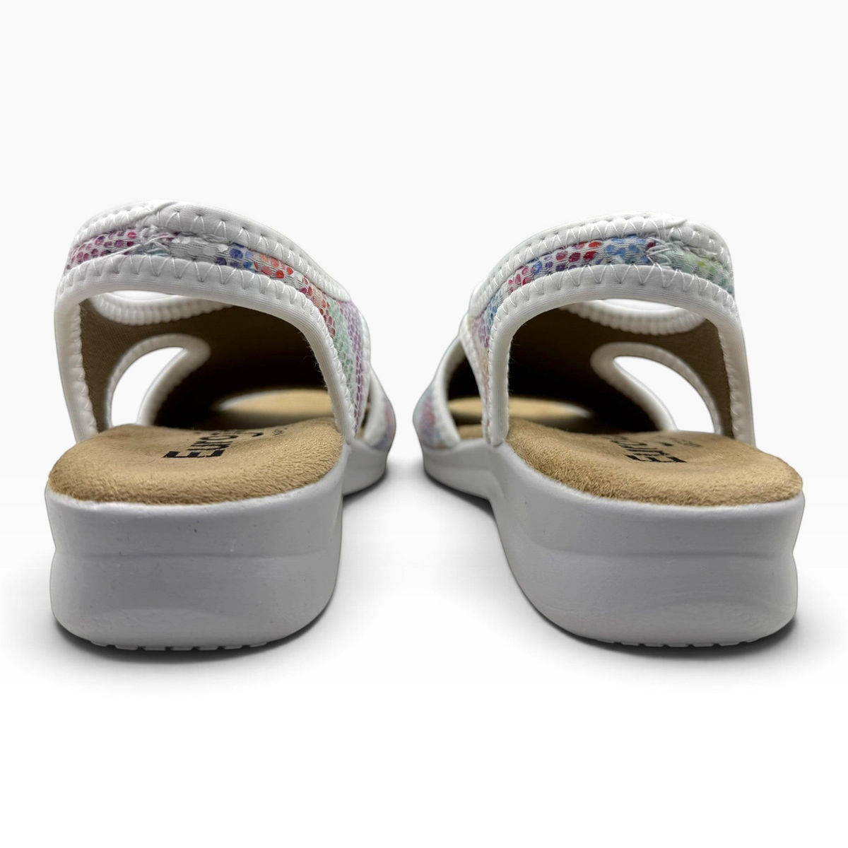The Shoe Shop Tuscany vegan sandals with a white low wedge sole and a colourful patterned elasticated heel strap.