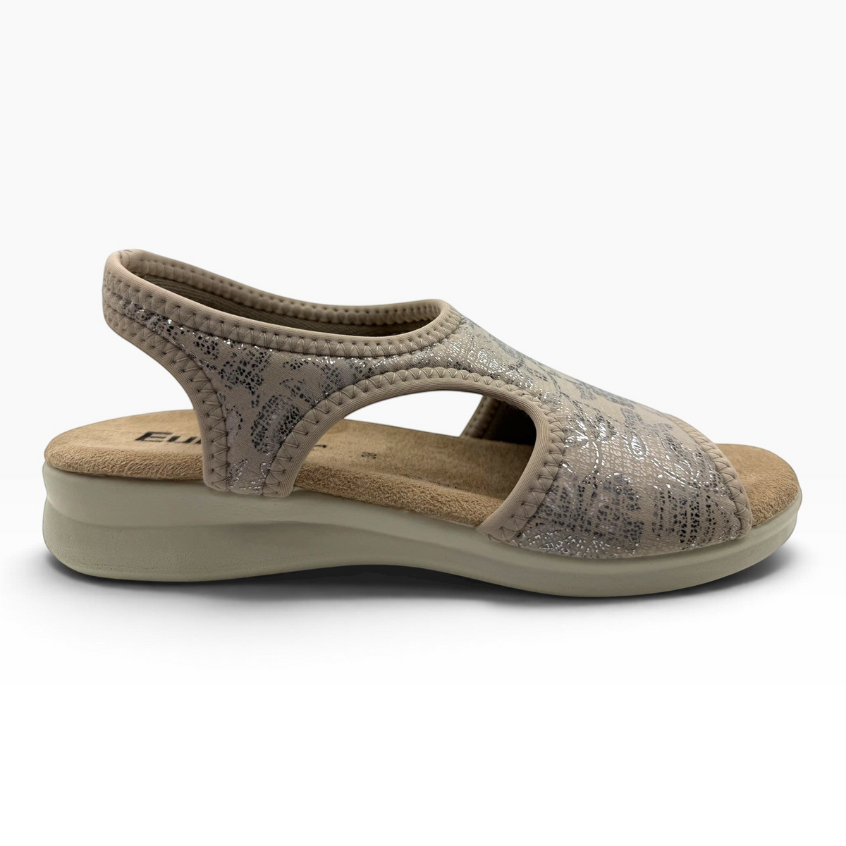 The Shoe Shop Tuscany vegan sandal in beige with a metallic pattern, featuring a cushioned low wedge and stretch fit.