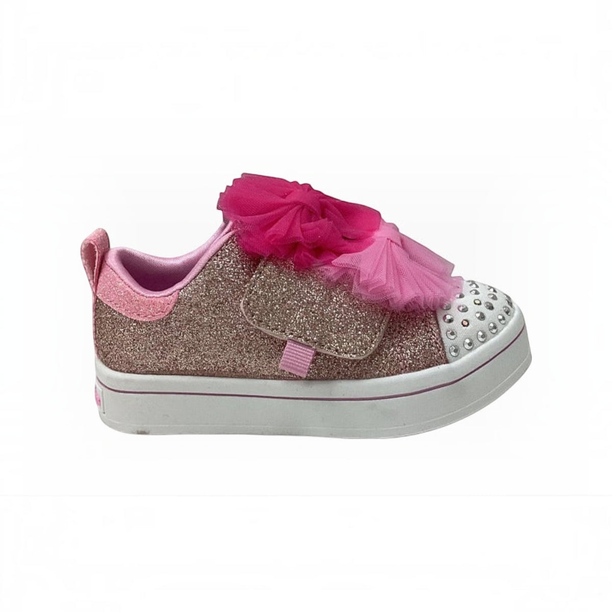 The Shoe Shop Twinkle Toes Twi-Lites 2.0 sneaker with pink glitter, rhinestone toe cap, and tulle bow detail.