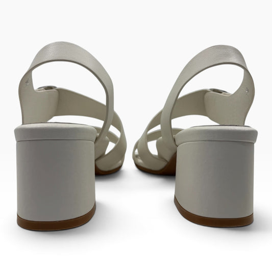 Back view of The Shoe Shop Vibe white block heel sandals with slingback straps on a white background