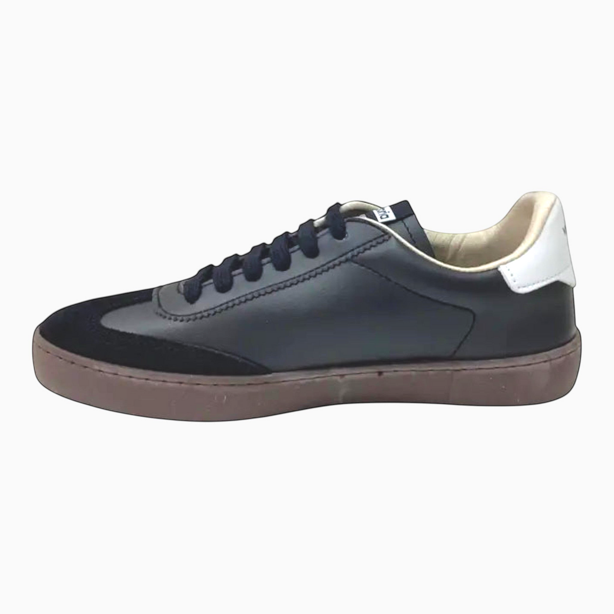 The Shoe Shop Victoria Berlin black leather and suede low-profile sneaker with a white heel tab and brown rubber sole.