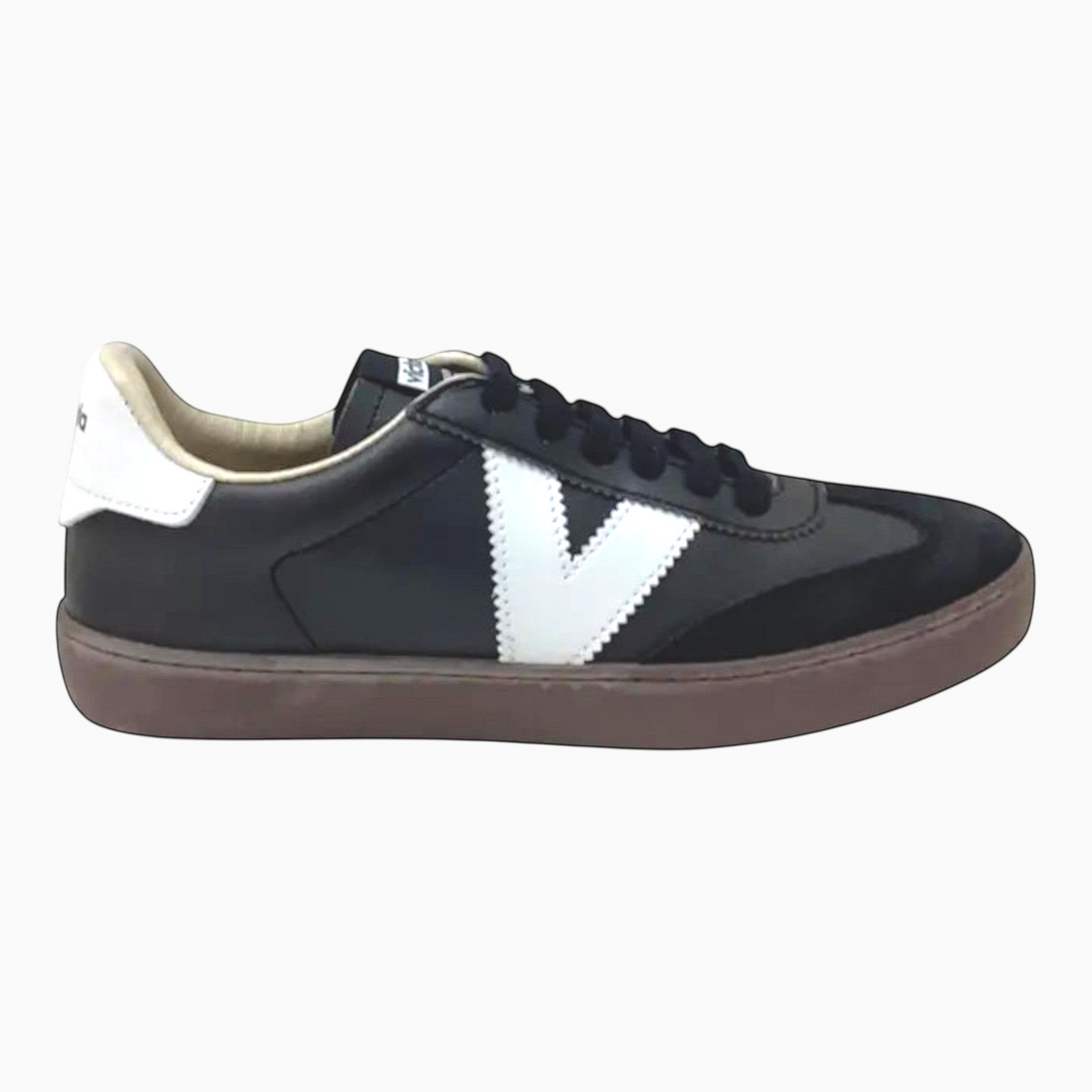 The Shoe Shop Victoria Berlin Negro sneaker in black leather and suede with a white V logo and brown rubber sole.