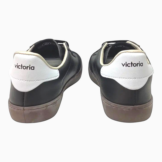 The Shoe Shop Victoria Berlin black leather sneakers with white heel tabs and Victoria branding, rear view.