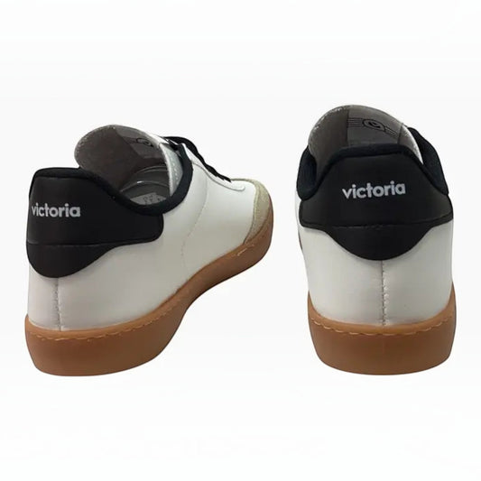 The Shoe Shop Victoria Berlin sneakers in white leather with black heel tabs and gum rubber soles, rear view.