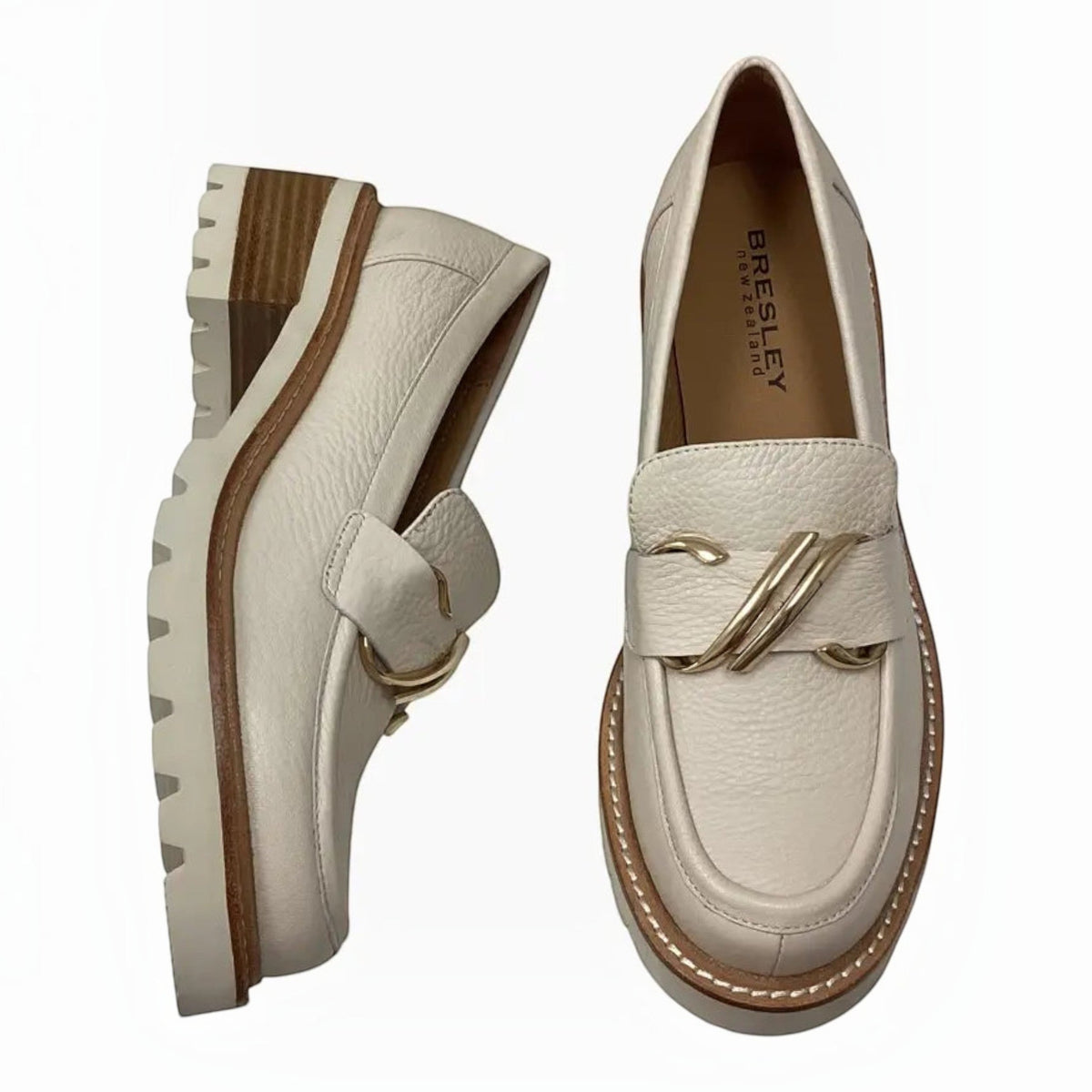 The Shoe Shop Bresley Dylan white leather loafers featuring a front zip, gold-tone buckle, and low block heel.