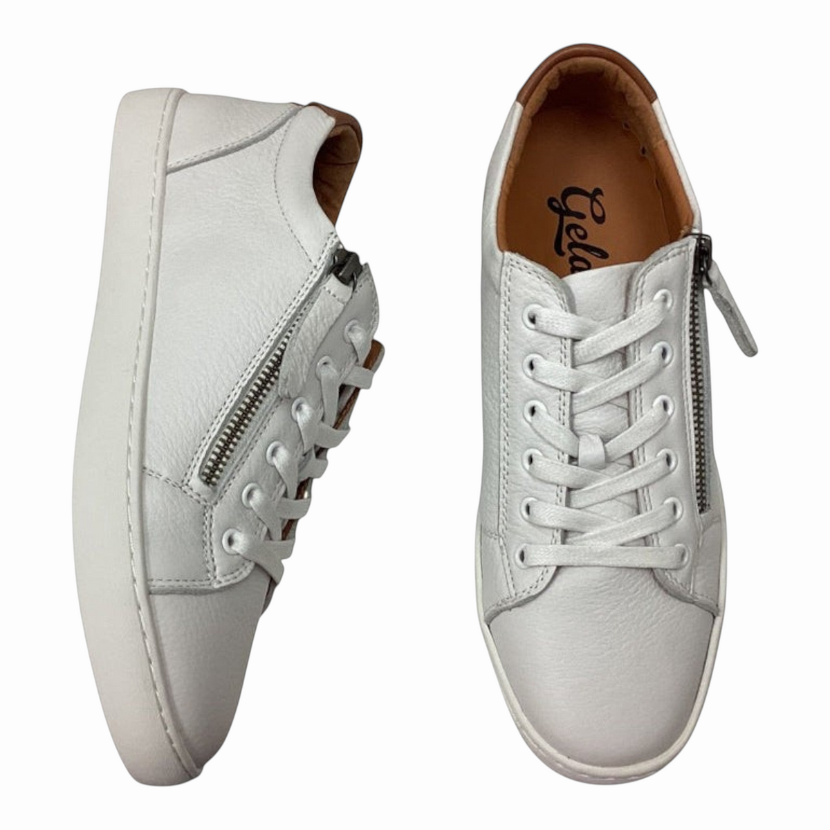 The Shoe Shop Gelato Manhatten white pebbled leather sneakers with side zip, tan heel tab, and rubber sole.