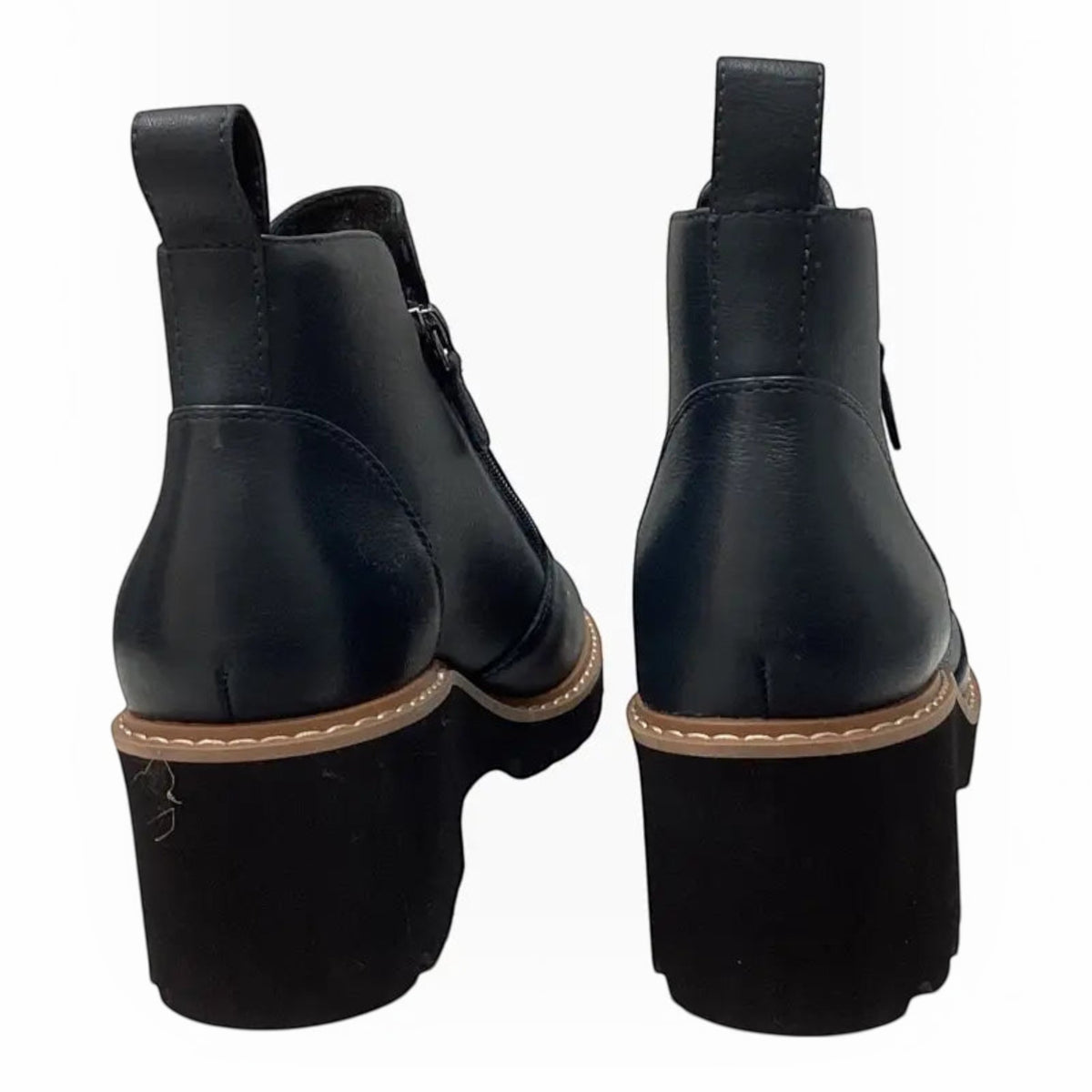The Shoe Shop Whitney black leather ankle boots with wedge heels and side zips, shown from the back view.