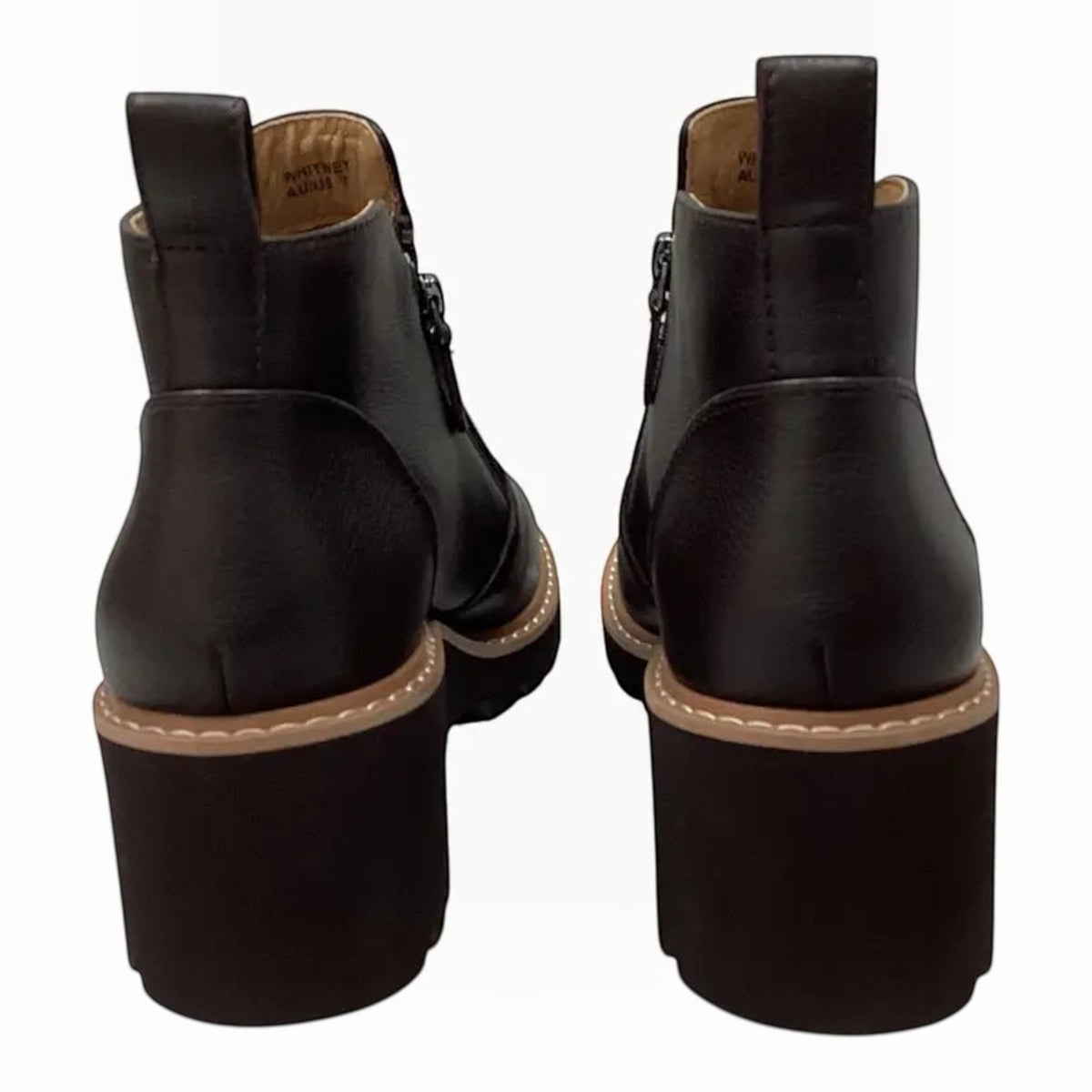 The Shoe Shop Whitney black leather ankle boots featuring a 60mm wedge heel and rear pull tabs, back view.