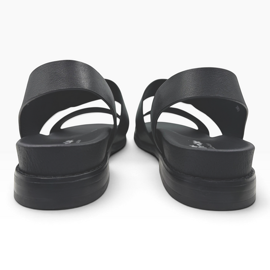 The Shoe Shop Willa black leather sandals featuring a comfortable slingback strap and a flat sole, rear view.