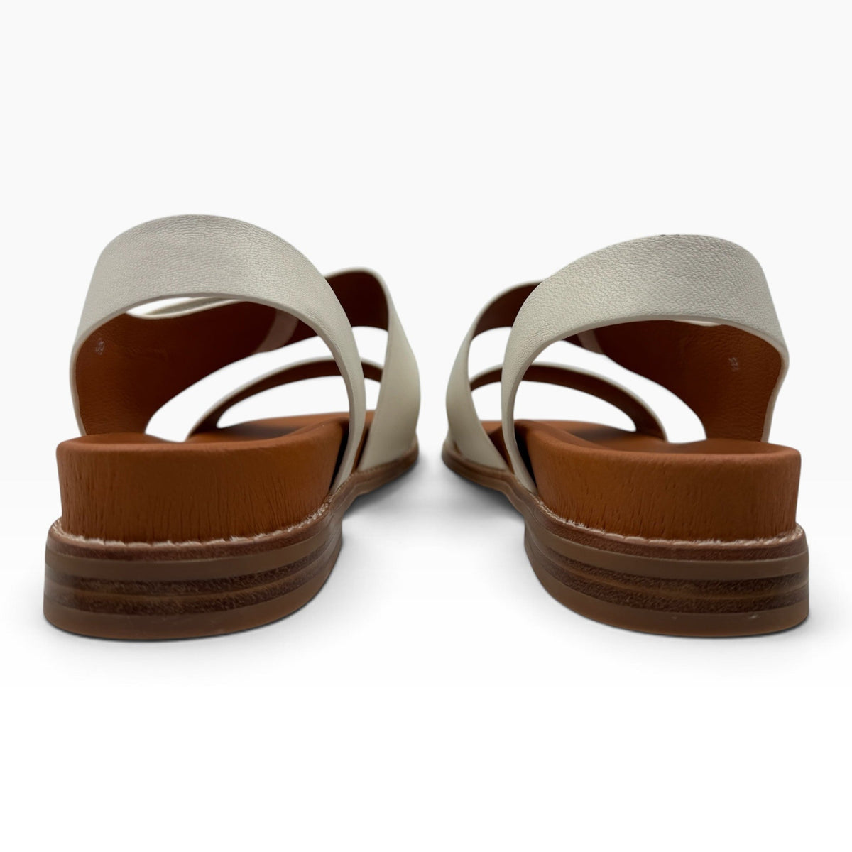 The Shoe Shop Willa sandals in cream leather with a brown platform sole, shown from the back view.