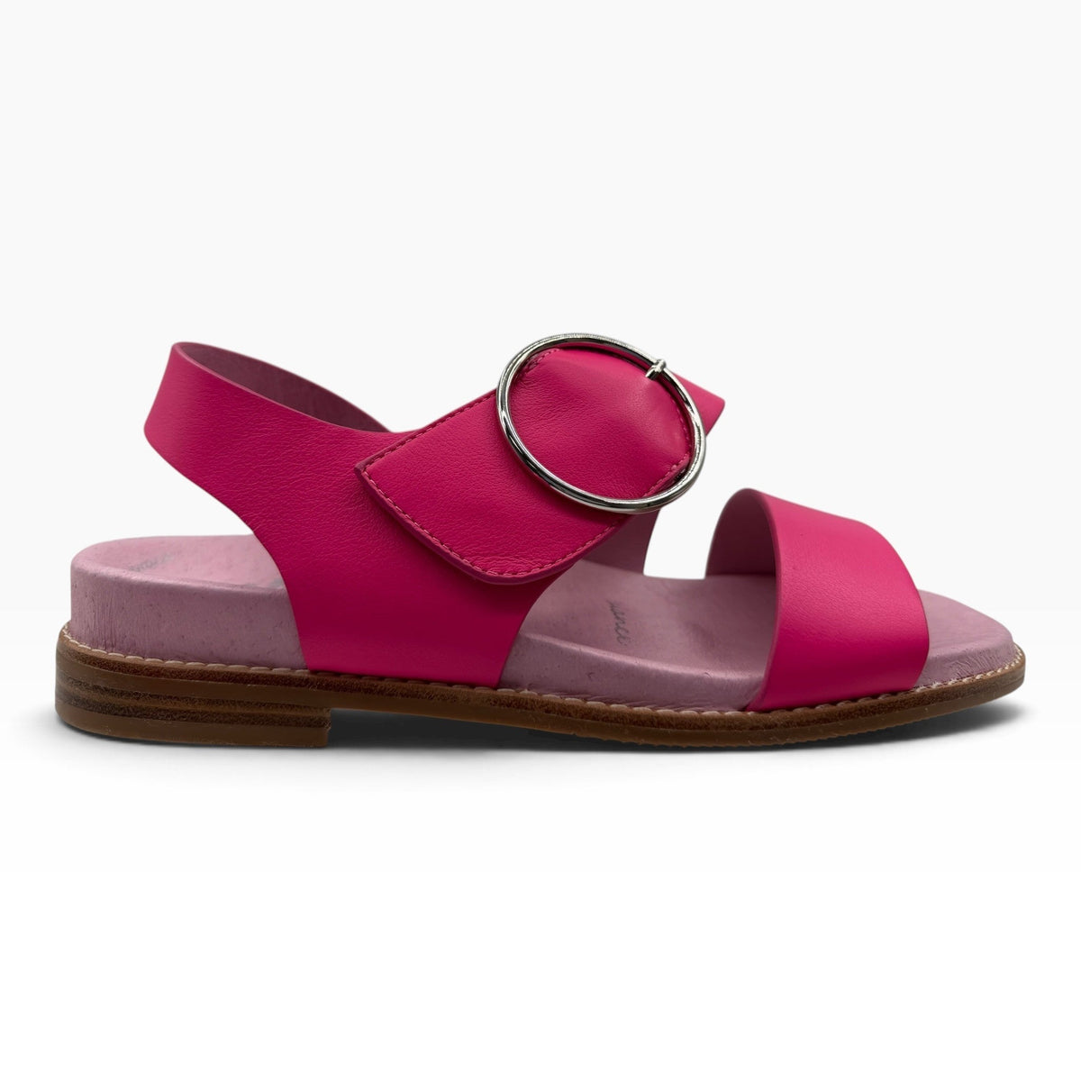 The Shoe Shop Willa fuchsia pink leather flat sandal with a large silver circular buckle and light pink footbed