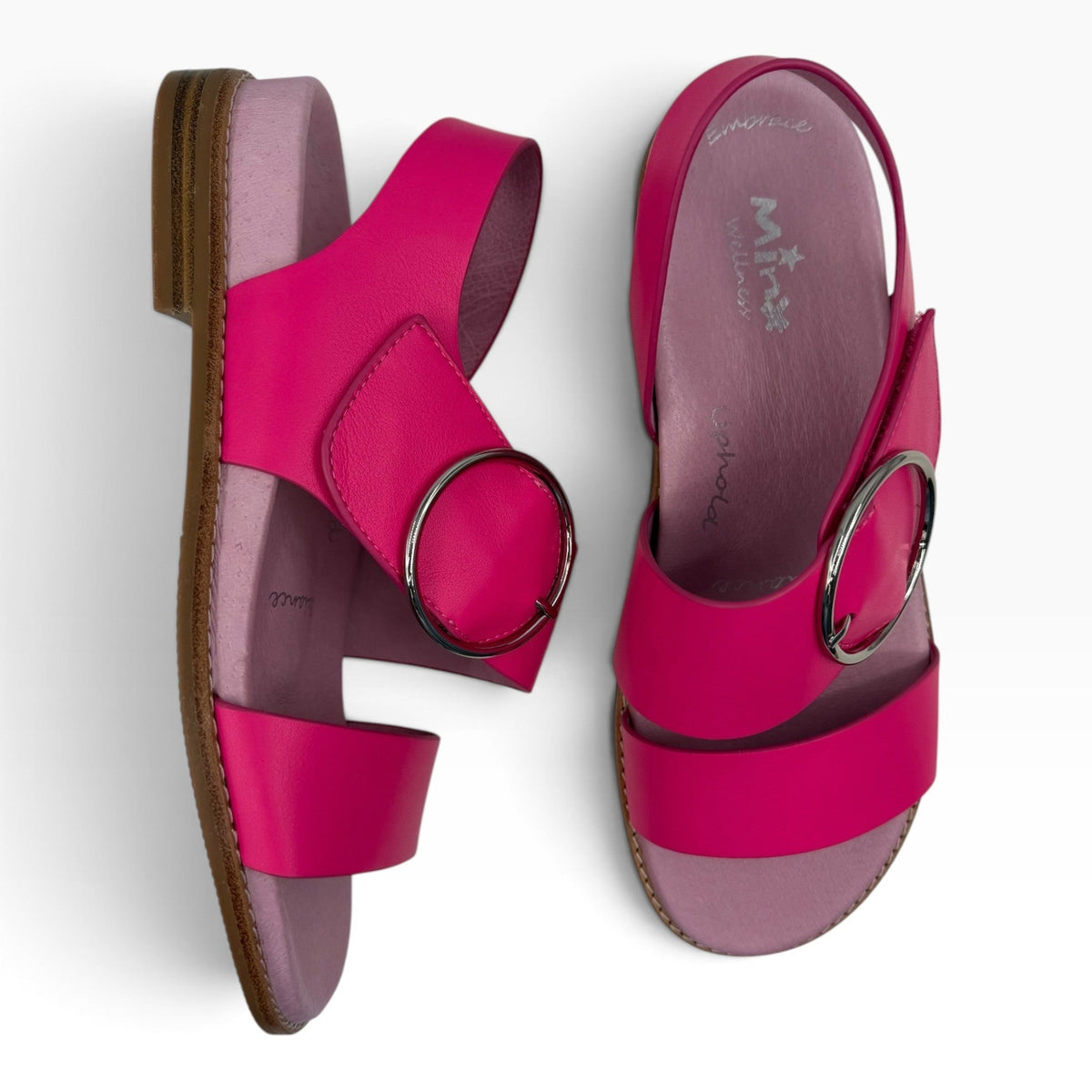 The Shoe Shop Willa hot pink leather sandals with a large silver buckle and comfortable lilac footbed