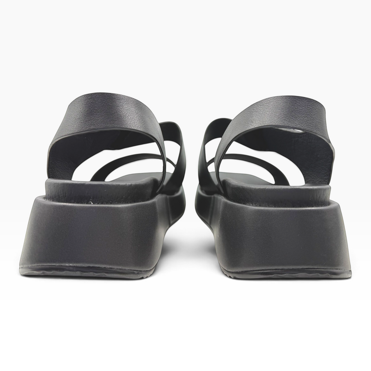 The Shoe Shop Zen black platform sandals with thick straps and a chunky sole, viewed from the back