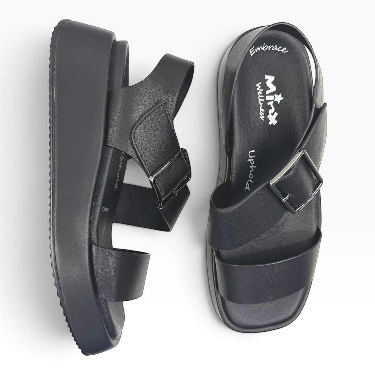 The Shoe Shop Zen black platform sandals with adjustable buckle straps and cushioned footbed, top view.