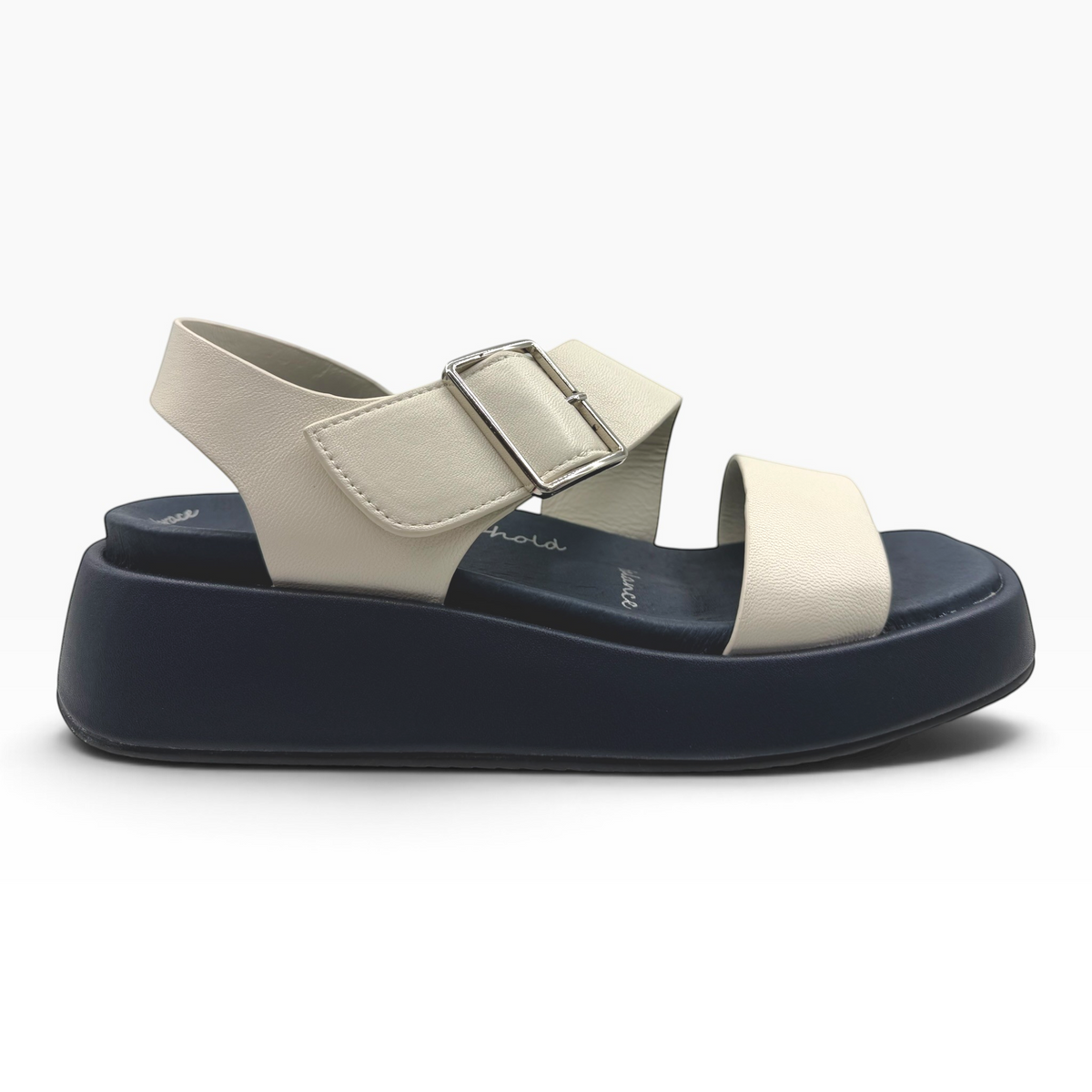 The Shoe Shop Zen platform sandals featuring off-white leather straps with a silver buckle on a dark navy sole