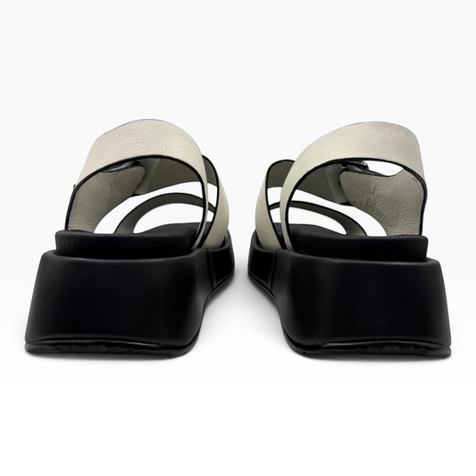 The Shoe Shop Zen platform sandals featuring white leather straps and a chunky black sole, rear view.