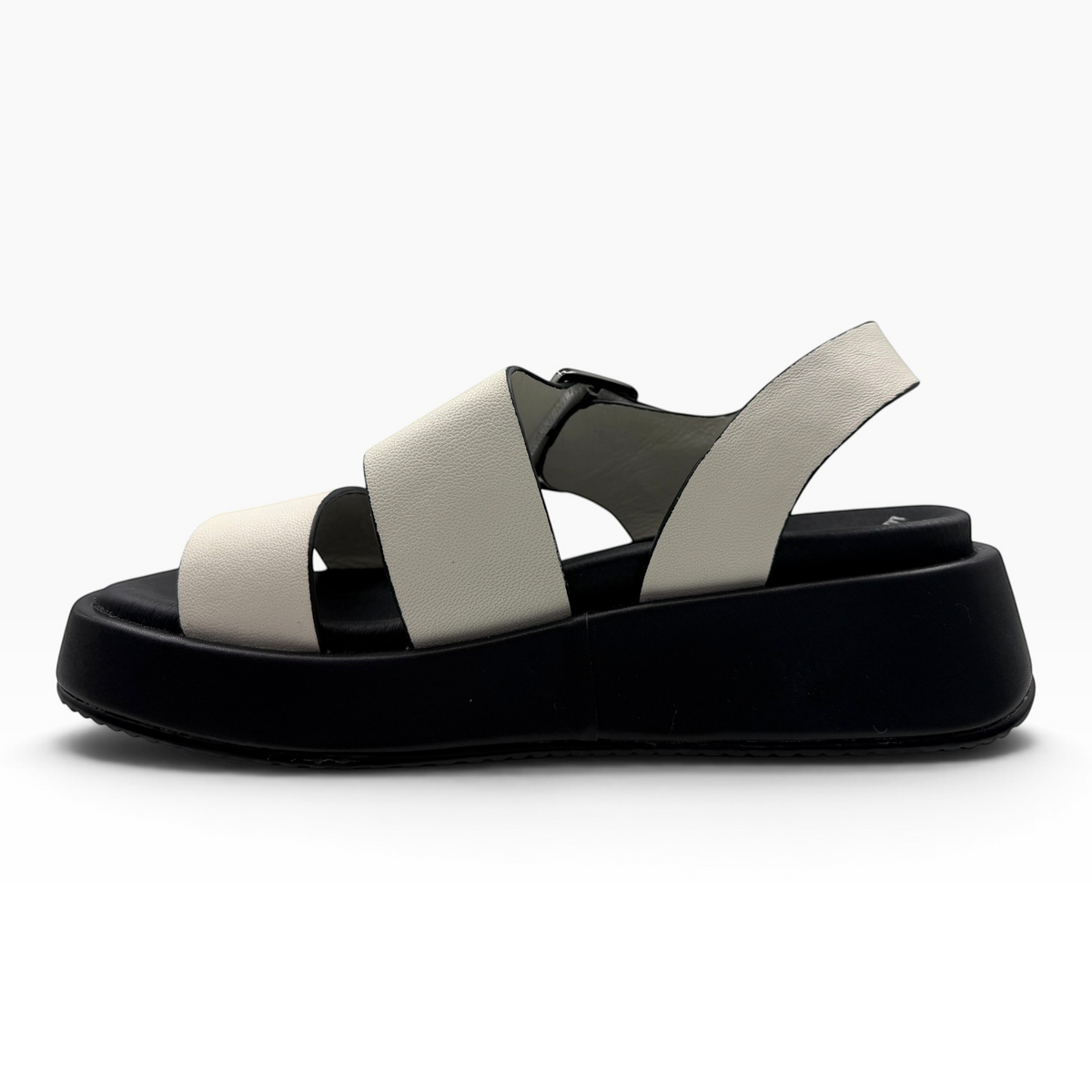 The Shoe Shop Zen platform sandals featuring white leather straps and a thick black sole in a side profile view.