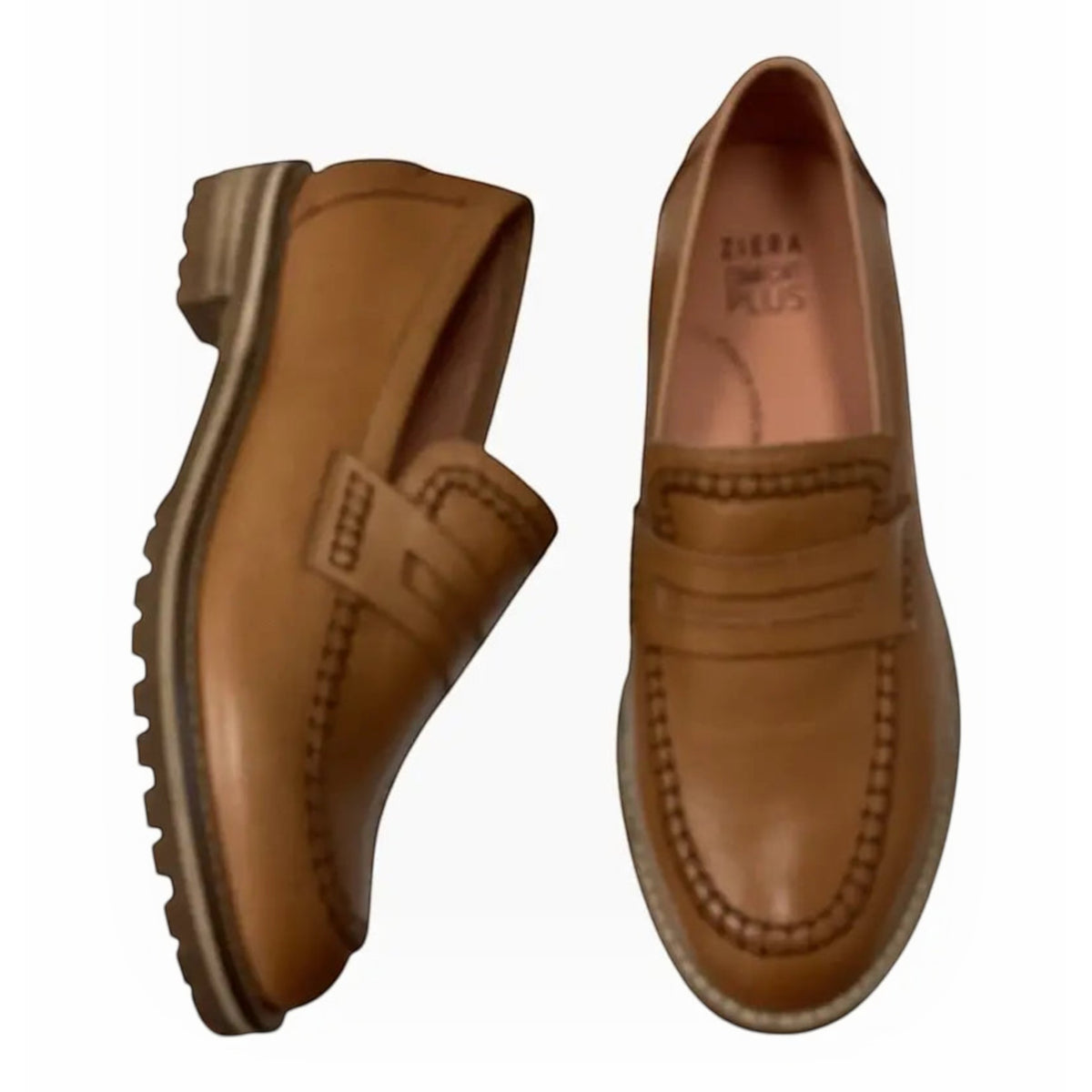 The Shoe Shop Ziera Maudle tan leather loafers featuring a chunky lug sole, penny strap, and moc toe stitching.