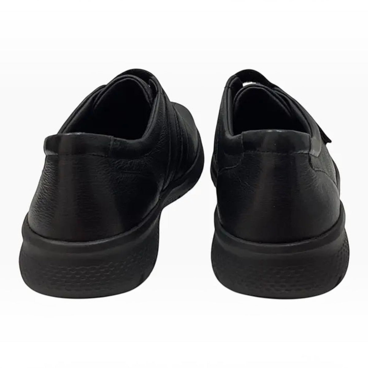 Rear view of The Shoe Shop Ziera Sonnye black leather sneakers with a wide, stable heel and slip-resistant sole.