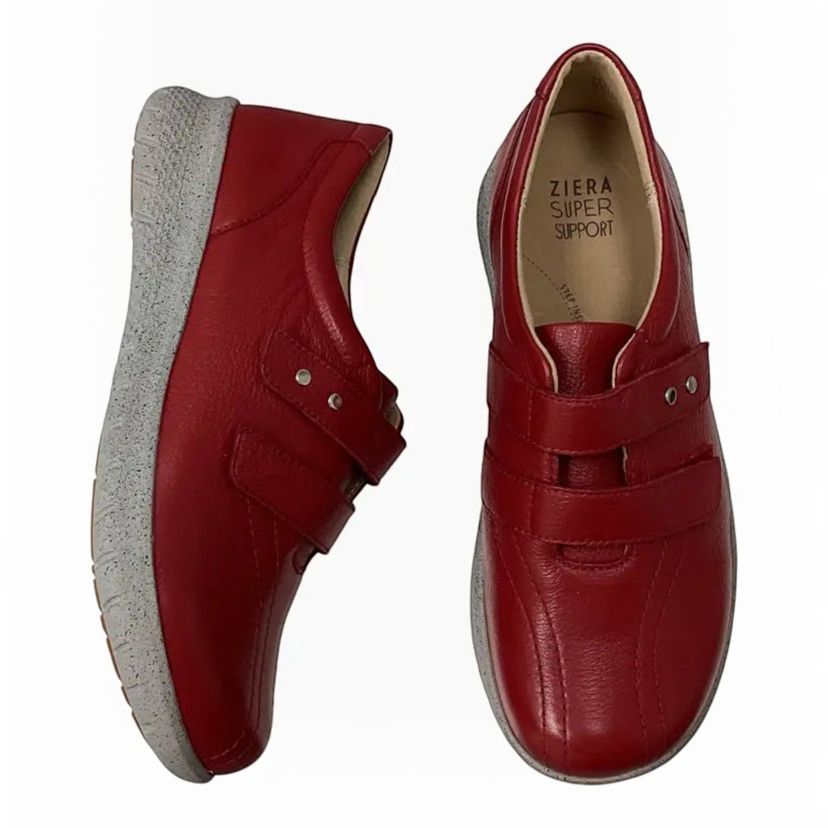 The Shoe Shop Ziera Sonnye red leather sneakers with hook-and-loop straps, grey textured soles, and arch support.