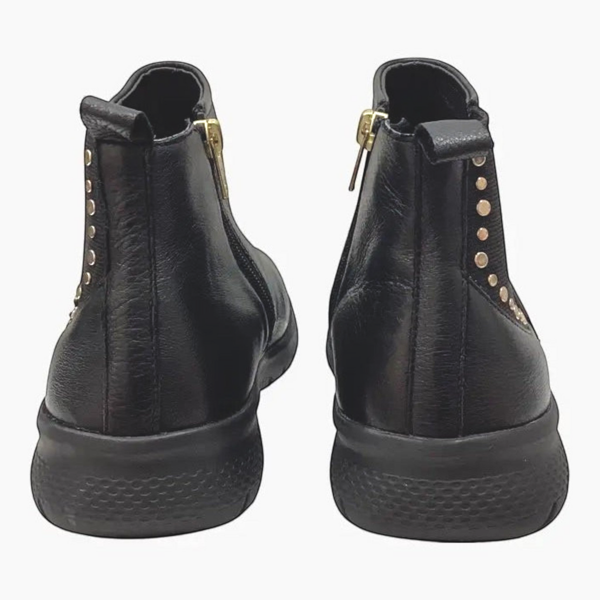 The Shoe Shop Ziera Suji black leather ankle boots featuring a side zip, elastic gusset, and metallic stud detailing.